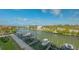 Scenic waterfront view featuring boat docks, boats, and luxurious waterfront homes at 1709 N Tamiami Trl # 408, Sarasota, FL 34234