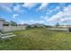 Expansive backyard with ample space for recreation and lounge chairs for relaxation at 17119 Harvest Moon Way, Bradenton, FL 34211