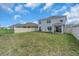 Spacious backyard with a covered patio, ideal for outdoor entertaining and relaxation at 17119 Harvest Moon Way, Bradenton, FL 34211