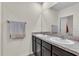 Modern bathroom with double sinks, ample counter space, and a large mirror providing functionality and style at 17119 Harvest Moon Way, Bradenton, FL 34211