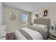 Comfortable bedroom with a tufted headboard, stylish decor, and serene color palette for a restful retreat at 17119 Harvest Moon Way, Bradenton, FL 34211