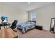 Bright bedroom with a comfortable bed, work station, and minimalist decor creating a peaceful atmosphere at 17119 Harvest Moon Way, Bradenton, FL 34211