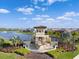 Stunning aerial view of the Solara community showcasing the lake, fountain, and beautiful landscaping at 17119 Harvest Moon Way, Bradenton, FL 34211