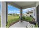 Cozy covered patio overlooking a sizable backyard, perfect for outdoor living at 17119 Harvest Moon Way, Bradenton, FL 34211