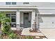 Inviting front entrance featuring a cozy sitting area and tasteful landscaping at 17119 Harvest Moon Way, Bradenton, FL 34211