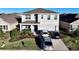 Charming two-story home with a well-manicured lawn, beautiful landscaping, and a two car garage at 17119 Harvest Moon Way, Bradenton, FL 34211