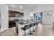 Bright kitchen showcasing a central island, stainless steel appliances, and a view into the adjacent dining area at 17119 Harvest Moon Way, Bradenton, FL 34211