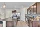 Spacious kitchen includes an island with seating, stainless steel appliances, and stylish granite countertops at 17119 Harvest Moon Way, Bradenton, FL 34211