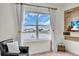 Relaxing living room featuring a window with scenic water views, comfortable chair, and decorative elements at 17119 Harvest Moon Way, Bradenton, FL 34211
