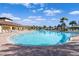 Community pool with ample seating and lush landscaping at 17119 Harvest Moon Way, Bradenton, FL 34211