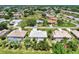 Aerial view of a neighborhood with many single-Gathering homes and green spaces at 26137 Dunedin Ct, Punta Gorda, FL 33983