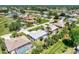 Aerial view of a neighborhood with many single-Gathering homes with screened in pools at 26137 Dunedin Ct, Punta Gorda, FL 33983