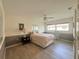 Bedroom featuring wood floors, a ceiling fan, and neutral-toned walls at 26137 Dunedin Ct, Punta Gorda, FL 33983