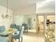Bright dining room with mirrored wall and easy access to the kitchen at 26137 Dunedin Ct, Punta Gorda, FL 33983