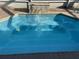 Outdoor hot tub features a waterfall and built in seats at 26137 Dunedin Ct, Punta Gorda, FL 33983