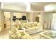 Cozy living area with high ceilings and sliding glass doors leading to the outside patio at 26137 Dunedin Ct, Punta Gorda, FL 33983