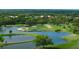 Picturesque golf course view featuring lush greenery, serene lake, and meticulously manicured greens at 2770 Temple Street, Sarasota, FL 34239