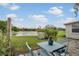 Outdoor patio with lake view, offering a serene setting with seating and natural beauty at 2907 51St W Ave, Bradenton, FL 34205