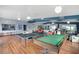 Expansive game room featuring a pool table, ping pong table, and multiple seating areas at 2907 51St W Ave, Bradenton, FL 34205