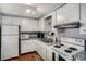 Bright kitchen features white appliances, ample cabinet space, and durable countertops for easy meal preparation at 2907 51St W Ave, Bradenton, FL 34205