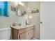 Charming half-bath featuring a single vanity with beach-themed decor and nautical accents at 2907 51St W Ave, Bradenton, FL 34205