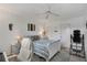Serene bedroom with ceiling fan, striped bedding, white furniture, and ample space at 2907 51St W Ave, Bradenton, FL 34205