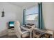 Bright home office with white furniture, a large window, and nautical decorations at 2907 51St W Ave, Bradenton, FL 34205