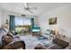 Cozy living room with stylish décor, comfortable seating, and a view to the patio and water at 2907 51St W Ave, Bradenton, FL 34205