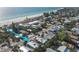 Aerial view of a coastal community, showcasing the home's proximity to the beach at 3007 Avenue E # A, Holmes Beach, FL 34217