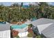 Aerial view showcasing a private pool, lush landscaping, and the home's layout at 3007 Avenue E # A, Holmes Beach, FL 34217
