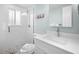 Bathroom featuring a glass enclosed shower, modern vanity, and decorative wall art, offering a refreshing space at 3007 Avenue E # A, Holmes Beach, FL 34217