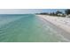 Scenic beach view of a pristine shoreline with calm, turquoise waters perfect for swimming and relaxation at 3007 Avenue E # A, Holmes Beach, FL 34217