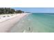 Coastal scenery features turquoise waters meeting sandy beach under a sunny sky at 3007 Avenue E # A, Holmes Beach, FL 34217