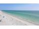 Tranquil beach scene with turquoise waters, white sand, and beachgoers enjoying the weather at 3007 Avenue E # A, Holmes Beach, FL 34217