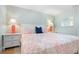 Comfortable bedroom featuring a queen bed with decorative pillows and soft lighting from bedside lamps at 3007 Avenue E # A, Holmes Beach, FL 34217
