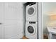 Stacked laundry machines conveniently located in the hallway at 3007 Avenue E # A, Holmes Beach, FL 34217