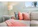 Close-up view of a comfortable couch decorated with decorative pillows and a throw blanket at 3007 Avenue E # A, Holmes Beach, FL 34217