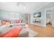Bright and airy living room connects to the doorway of a well-lit bedroom space at 3007 Avenue E # A, Holmes Beach, FL 34217