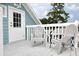Intimate balcony with outdoor seating provides a serene spot to enjoy the surrounding views at 3504 Estrada St, Sarasota, FL 34239