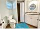 Cozy bathroom features a shower, toilet, and vanity with granite countertops at 3504 Estrada St, Sarasota, FL 34239