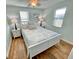 Bright bedroom with a cozy bed, side tables, and windows for natural light at 3504 Estrada St, Sarasota, FL 34239