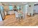 Bright kitchen with stainless steel appliances, white cabinetry, and a cute breakfast table at 3504 Estrada St, Sarasota, FL 34239