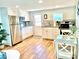 Bright kitchen with stainless steel appliances, white cabinetry, and a cute breakfast table at 3504 Estrada St, Sarasota, FL 34239