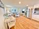 Inviting living area with a sofa, dining space, modern decor and a fully equipped kitchen with stainless steel appliances at 3504 Estrada St, Sarasota, FL 34239
