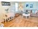 Bright living room area with hardwood floors, comfortable seating, and stylish decor at 3504 Estrada St, Sarasota, FL 34239