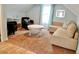 Cozy living room features plush seating, neutral tones, and a bright window at 3504 Estrada St, Sarasota, FL 34239