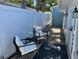 Cozy outdoor patio with comfortable seating and a privacy fence, perfect for relaxing and enjoying the fresh air at 3504 Estrada St, Sarasota, FL 34239