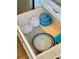 Interior storage drawer with neatly organized containers and kitchenware at 3504 Estrada St, Sarasota, FL 34239