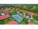 Bird's eye view of community featuring lush greenery, red roofs and a tennis court at 3630 White Pine Ct # 138, Sarasota, FL 34238