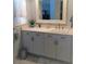 Bathroom vanity featuring a large mirror, quartz countertop and cabinetry at 3630 White Pine Ct # 138, Sarasota, FL 34238